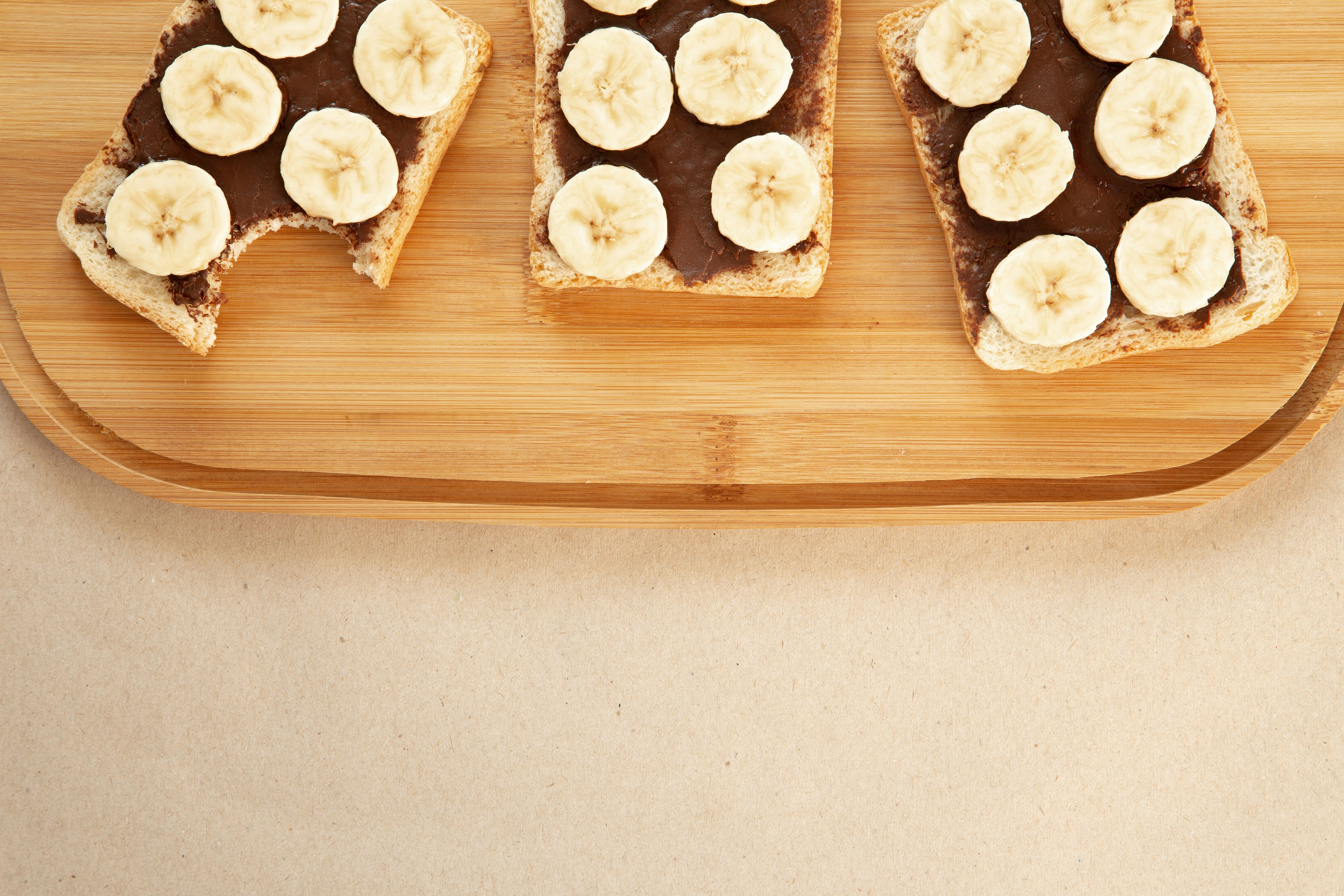 three slice of bread on wooden surface